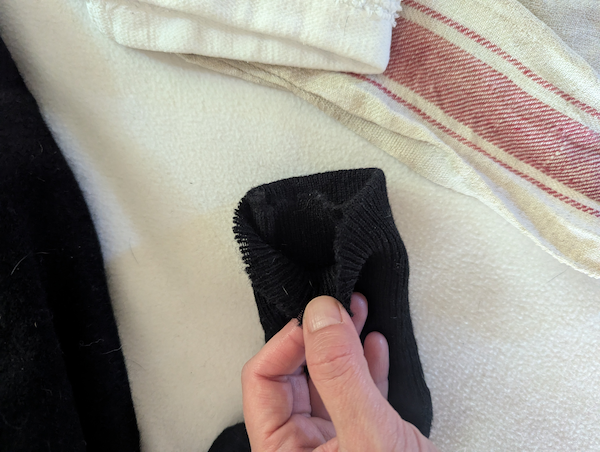 Manche pull avant réparation
